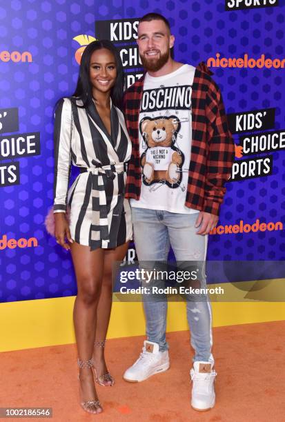 Player Travis Kelce and Kayla Nicole attend Nickelodeon Kids' Choice Sports Awards 2018 at Barker Hangar on July 19, 2018 in Santa Monica, California.