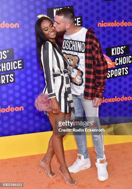 Player Travis Kelce and Kayla Nicole attend Nickelodeon Kids' Choice Sports Awards 2018 at Barker Hangar on July 19, 2018 in Santa Monica, California.