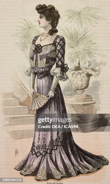 Woman wearing an evening dress, crepe de Chine skirt, velours inserts, creation by Mademoiselle Louise Piret, engraving from La Mode Illustree, No...