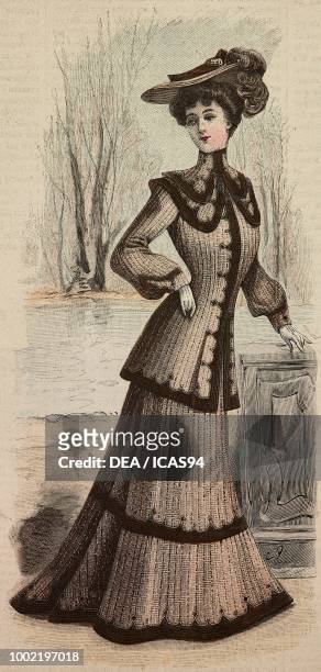 Woman in a city dress in homespun woolen fabric, with long jacket, creation by Mademoiselle Louise Piret, engraving from La Mode Illustree, No 49,...
