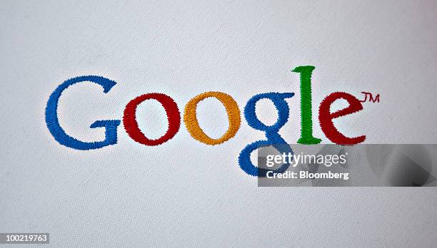 Pillow stitched with Google Inc.'s logo sits on display during the Google I/O Developers' Conference in San Francisco, California, U.S., on Thursday,...