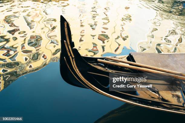 traditional gondola in a venice canal - gondola traditional boat stockfoto's en -beelden
