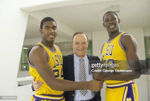 Portrait of Louisiana State coach Dale Brown with players John Williams and Tito Horford during photo shoot outside LSU Assembly Center. Baton Rouge,...