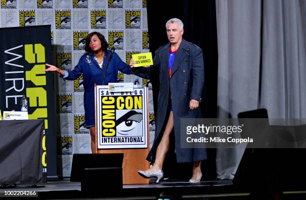 Aisha Tyler and John Barrowman speak onstage at The Great Debate panel hosted by SYFY WIRE during Comic-Con International 2018 at San Diego...