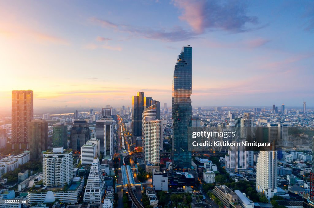 Aerial view of Bangkok modern office buildings, condominium, living place in Bangkok city downtown with sunset scenery, Bangkok is the most populated city in Southeast Asia.Bangkok , Thailand