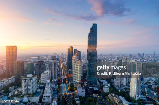 aerial view of bangkok modern office buildings, condominium, living place in bangkok city downtown with sunset scenery, bangkok is the most populated city in southeast asia.bangkok , thailand - bangkok imagens e fotografias de stock