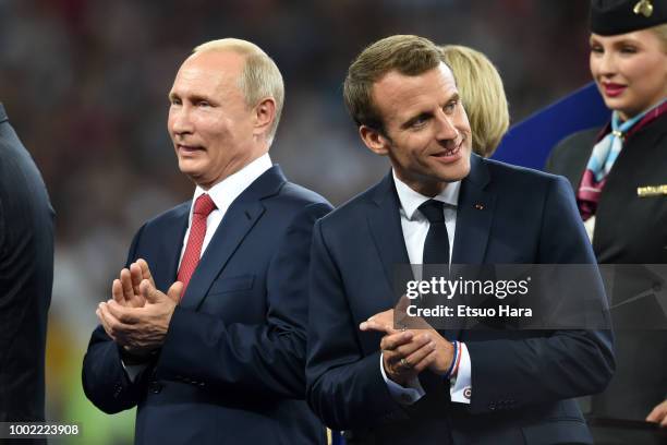 President of Russia Vladimir Putin,and President of France Emmanuel Macron are seen during the trophy ceremony following the 2018 FIFA World Cup...