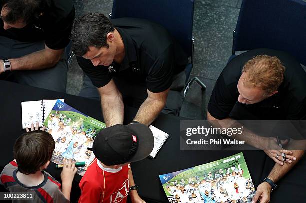 Ryan Nelsen and Simon Elliott of the New Zealand All Whites sign autographs for fans during their farewell function ahead of Monday's 2010 FIFA World...