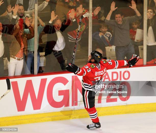 Dustin Byfuglien of the Chicago Blackhawks reacts after scoring the game-winning goal in overtime to defeat the San Jose Sharks 3-2 in Game Three of...