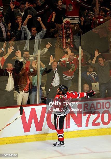 Dustin Byfuglien of the Chicago Blackhawks reacts after scoring the game-winning goal in overtime to defeat the San Jose Sharks 3-2 in Game Three of...