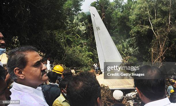 India's Aviation minister Praful Patel surveys the area of a plane crash, on May 22, 2010 in Mangalore. An Air India Express Boeing 737-800 series...
