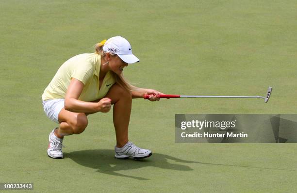 Amanda Blumenherst reacts after making her birdie putt on the 18th hole to extend her match during the third round of the Sybase Match Play...