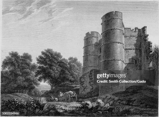 Black and white print showing "Donnington Castle, " a dilapidated medieval fortress, with castellations and two tall towers and a horse-drawn wagon...