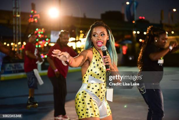 Msss Kamille provides skating lessons to guests during HBO's Mixtapes & Roller Skates at the Blue Cross RiverRink in Philadelphia, Pennsylvania on...