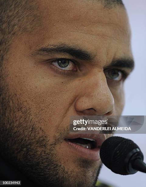 Brazilian footballer Daniel Alves speaks during a press conference regarding the South Africa 2010 World Cup, at a training centre in the southern...