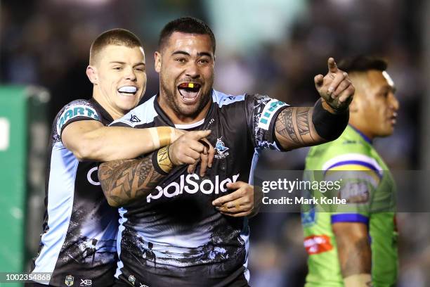 Andrew Fifita of the Sharks celebrates with his team mate Jayden Brailey of the Sharks after scoring a try Andrew Fifita during the round 19 NRL...