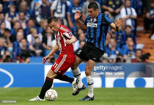 Ivica Olic of Bayern Muenchen is challenged by Lucio of Inter Milan during the UEFA Champions League Final match between FC Bayern Muenchen and Inter...