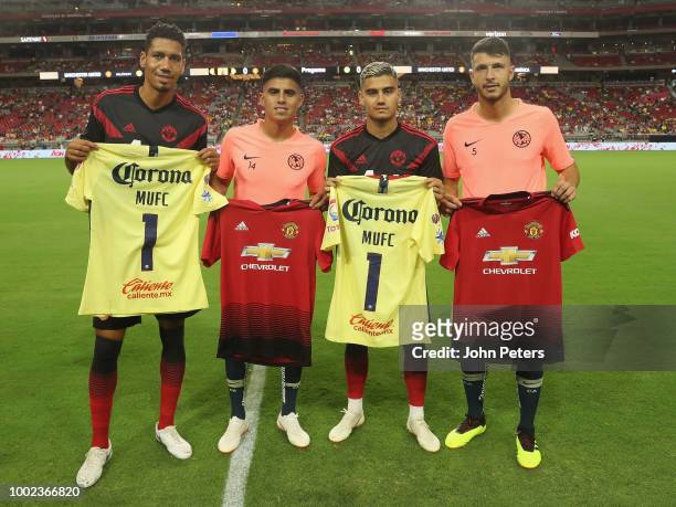 Players from Club America swap shirts with Chris Smalling and Andreas Pereira of Manchester United ahead of the pre-season friendly match between...