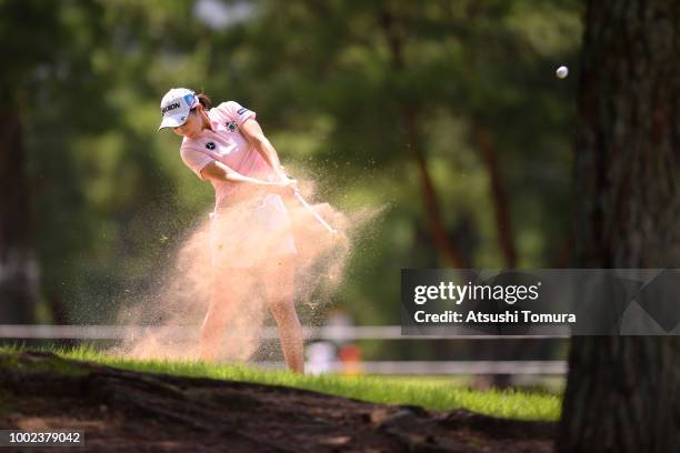 Momoka Miura of Japan hits her second shot on the 18th hole during the first round of the Century 21 Ladies Golf Tournament at the Seta Golf Course...