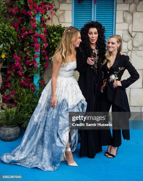 Lily James, Cher and Amanda Seyfried attend the UK Premiere of "Mamma Mia! Here We Go Again" at Eventim Apollo on July 16, 2018 in London, England.