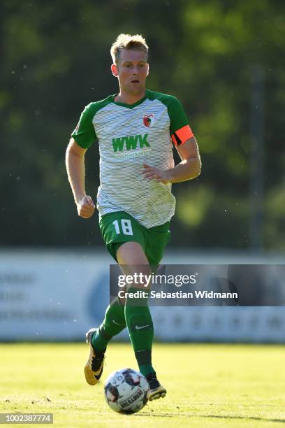 Jan-Ingwer Callsen-Bracker of Augsburg plays the ball during the pre-season friendly match between SC Olching and FC Augsburg on July 19, 2018 in...