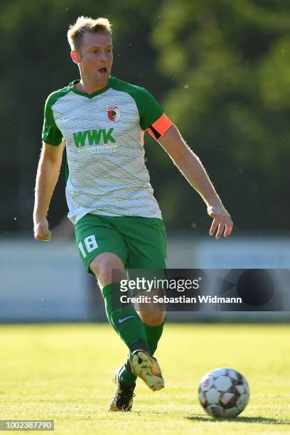 Jan-Ingwer Callsen-Bracker of Augsburg plays the ball during the pre-season friendly match between SC Olching and FC Augsburg on July 19, 2018 in...