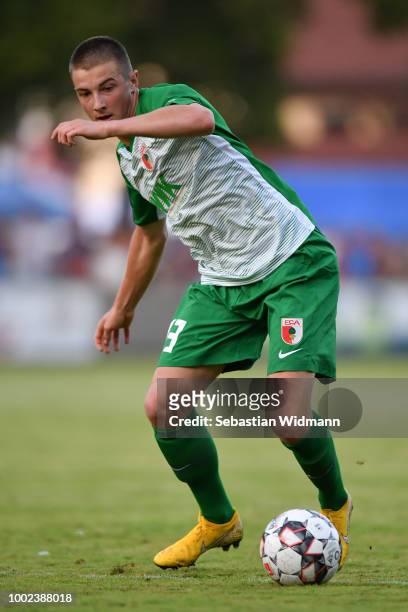 Lukas Petkov of Augsburg plays the ball during the pre-season friendly match between SC Olching and FC Augsburg on July 19, 2018 in Olching, Germany.