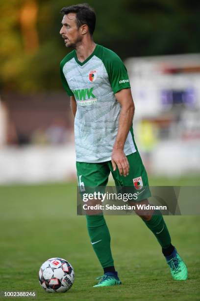 Christoph Janker of Augsburg plays the ball during the pre-season friendly match between SC Olching and FC Augsburg on July 19, 2018 in Olching,...