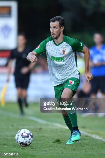 Christoph Janker of Augsburg plays the ball during the pre-season friendly match between SC Olching and FC Augsburg on July 19, 2018 in Olching,...
