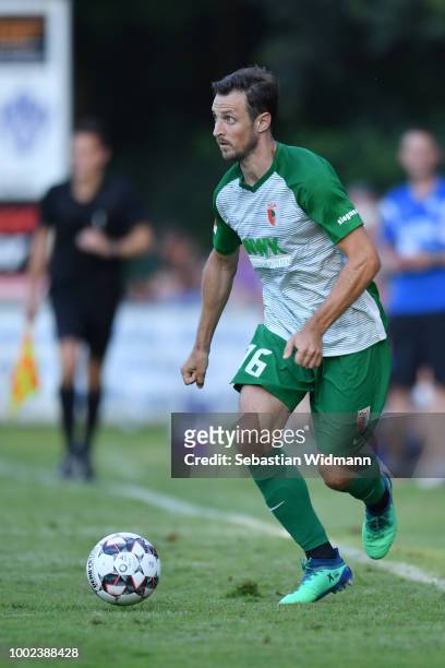 Christoph Janker of Augsburg plays the ball during the pre-season friendly match between SC Olching and FC Augsburg on July 19, 2018 in Olching,...