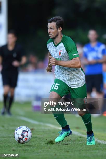 Christoph Janker of Augsburg plays the ball during the pre-season friendly match between SC Olching and FC Augsburg on July 19, 2018 in Olching,...