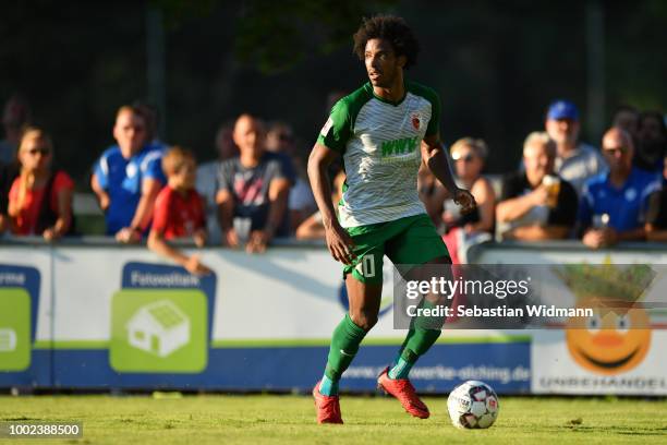 Francisco da Silva Caiuby of Augsburg plays the ball during the pre-season friendly match between SC Olching and FC Augsburg on July 19, 2018 in...