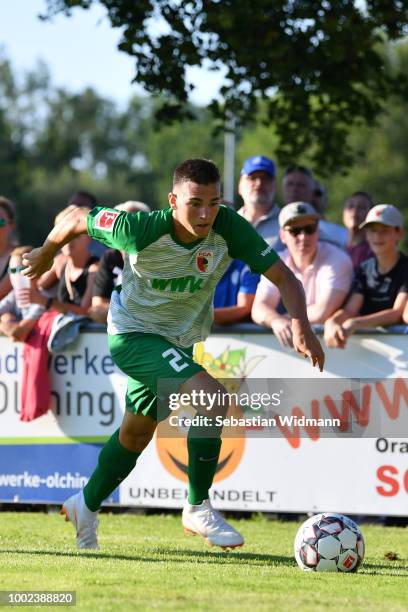 Romario Roesch of Augsburg plays the ball during the pre-season friendly match between SC Olching and FC Augsburg on July 19, 2018 in Olching,...