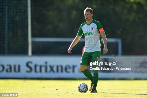 Jan-Ingwer Callsen-Bracker of Augsburg plays the ball during the pre-season friendly match between SC Olching and FC Augsburg on July 19, 2018 in...
