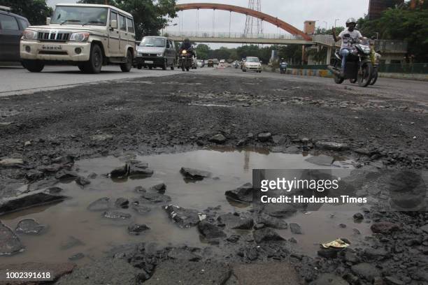 The recent heavy spell of showers have increased the problem of commuters as huge potholes have appeared on various roads in the city after rain, on...