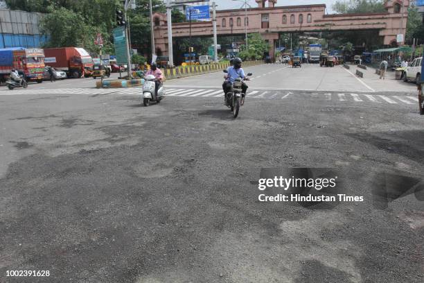 The recent heavy spell of showers have increased the problem of commuters as huge potholes have appeared on various roads in the city after rain, on...