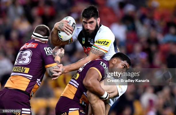 James Tamou of the Panthers is tackled by Tevita Pangai of the Broncos during the round 19 NRL match between the Brisbane Broncos and the Penrith...