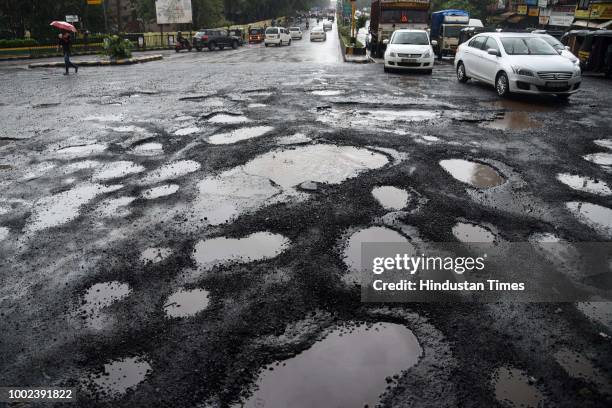 The recent heavy spell of showers have increased the problem of commuters as huge potholes have appeared on various roads in the city after rain, at...