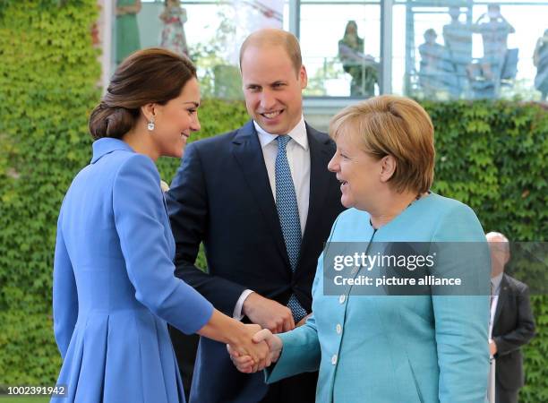 German Chancellor Angela Merkel receives Britain's Prince William and his wife Kate at the federal chancellery in Berlin, Germany, 19 July 2017....