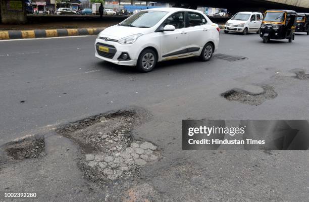 The recent heavy spell of showers have increased the problem of commuters as huge potholes have appeared on various roads in the city after rain, at...