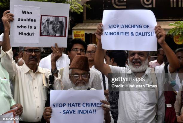 Activists from various organizations held a protest to condemn mob attack on Swami Agnivesh at CSMT, on July 19, 2018 in Mumbai, India.