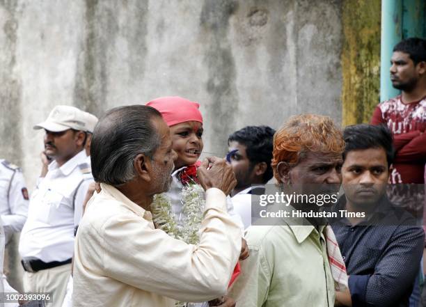 People participate during a procession in memory of Chota Shaikh Salla at his dargah in Kasba Peth, on July 19, 2018 in Pune, India. According to...