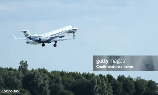 Great Britain's Prince William and Duchess Kate leave for England on a plane with their children George and Charlotte in Hamburg, Germany, 21 July...