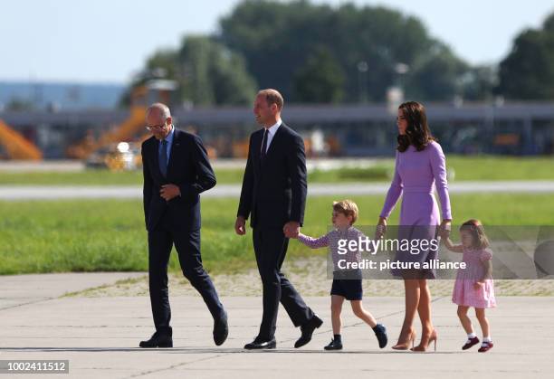 Great Britain's Prince William and Duchess Kate look at an Airbus helicopter with their children George and Charlotte, guided by the CEO of Airbus,...