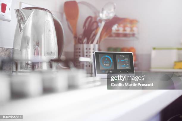 smart meter in the kitchen - new technology electricity stock pictures, royalty-free photos & images