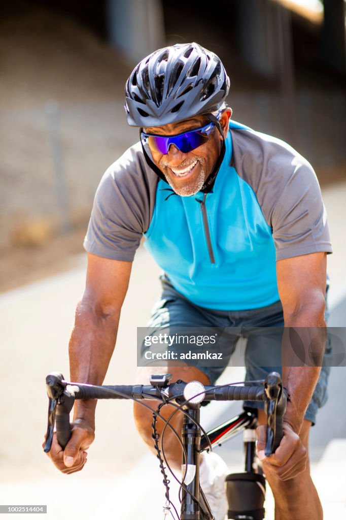 Black Man Racing Senior Black Man Racing On A Road Bike High-Res Stock Photo - Getty Images