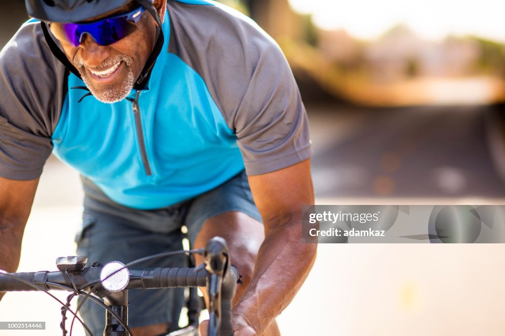 Black Man Racing Senior Black Man Racing On A Road Bike High-Res Stock Photo - Getty Images