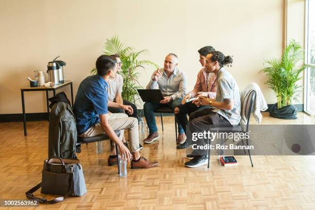 young men attending a group counselling session in queensland - australia training session stock pictures, royalty-free photos & images