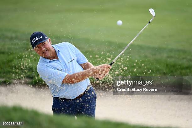 Ken Duke hits from a green side bunker on the second hole during the second round of the Barbasol Championship at Keene Trace Golf Club on July 20,...