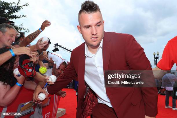 Mike Trout of the Los Angeles Angels of Anaheim and the American League signs autographs for fans at the 89th MLB All-Star Game, presented by...